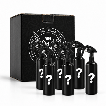 Sada černých rozprašovačů v černé mystery krabici s otazníky